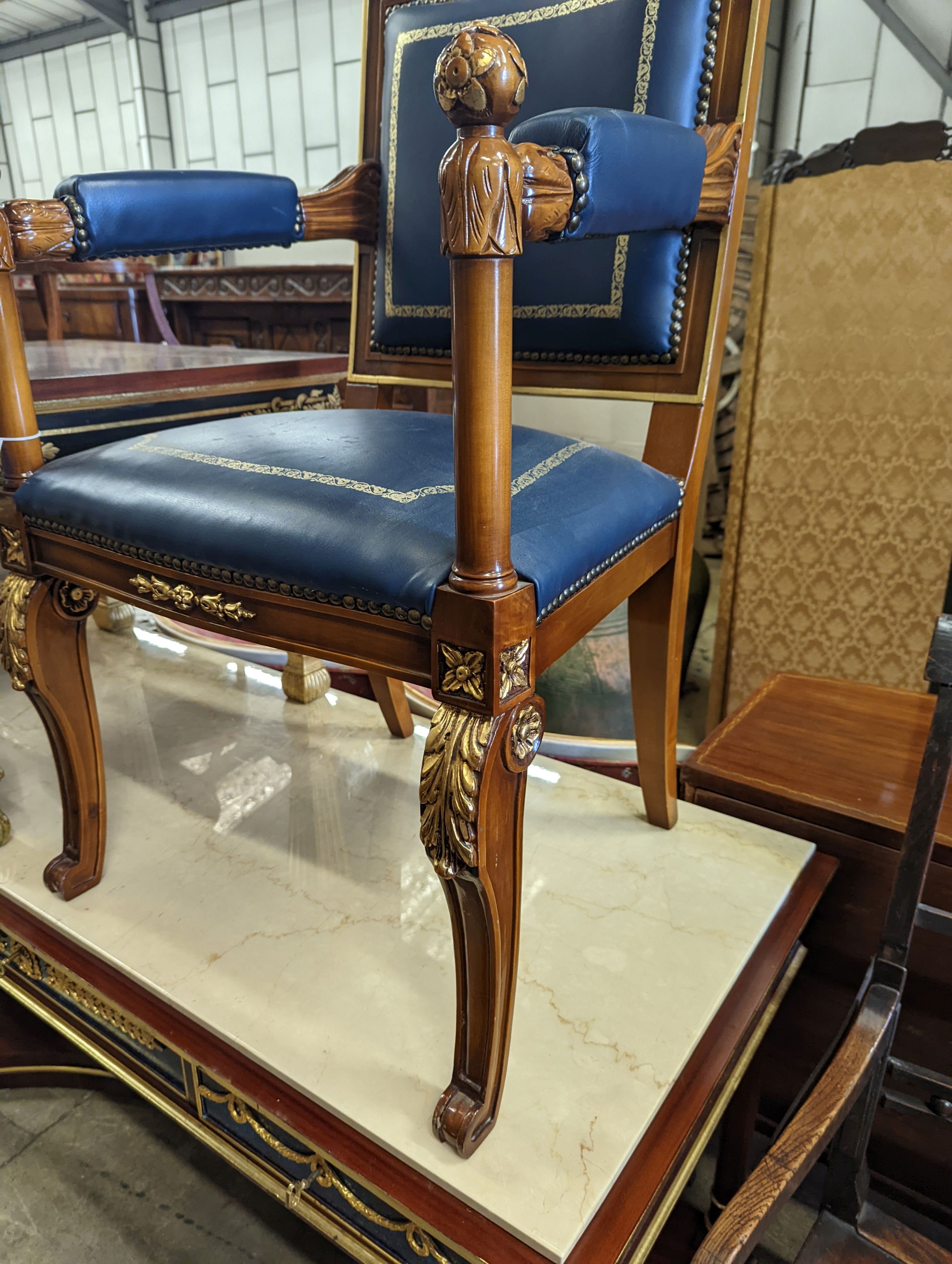 An Empire style parcel gilt mahogany elbow chair together with a similar square low occasional table, width 70cm, height 55cm
